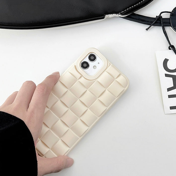 Model holding 3D Plaid Phone Case in white. Clean, soft-touch textured silicone cover for daily casual outfits.
