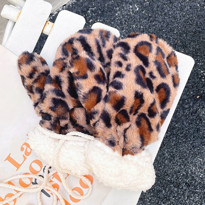 Dark leopard print fluffy gloves with plush texture; warm animal-print accessory for winter outings.