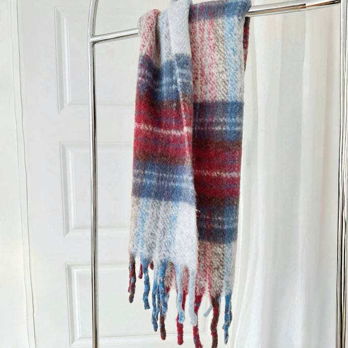 Flat lay of Autumn Ember Plaid Scarf in blue and red, great for office layering and commuting.