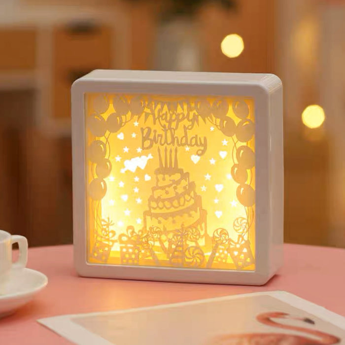 Close-up of Carved Paper Lamp in birthday case pattern.