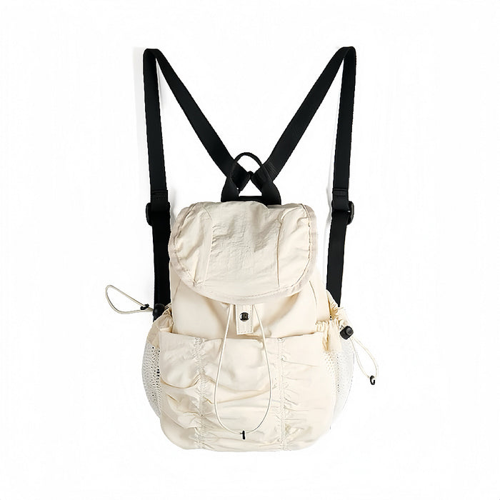 Front view of Cream-colored pleated nylon backpack; soft neutral tone ideal for spring fashion and light travel organization.