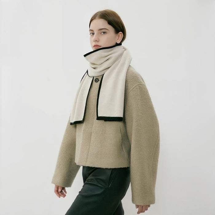 Model wearing a wool knit scarf in beige, easy for weekend styling and gifting.