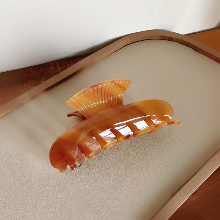 Front view of Shell Hair Claw hair claw clip in tan, easy for workdays and special occasions.