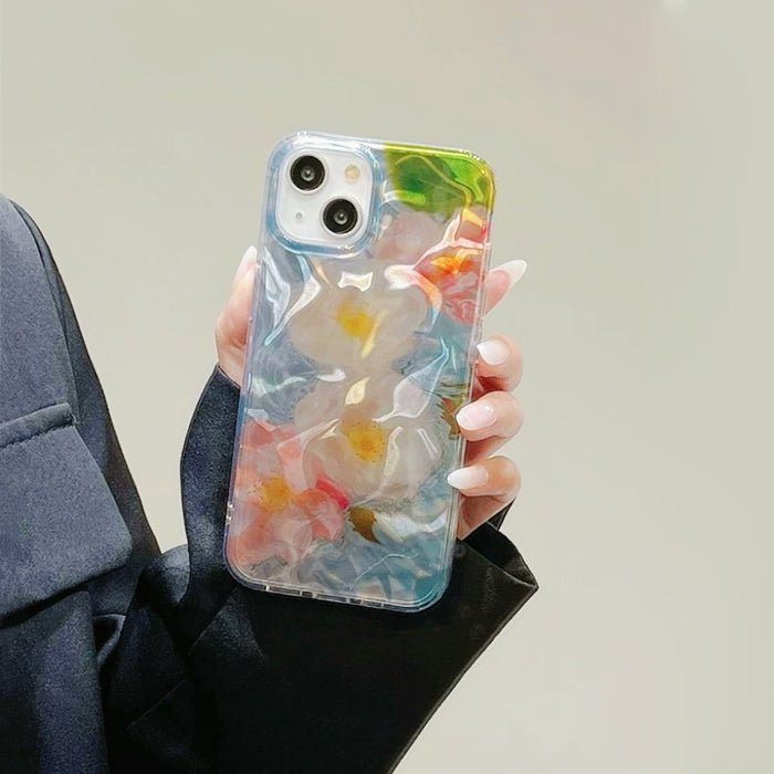 Model holding Flower In Water Case. Artistic watery floral design perfect for a soft feminine style.