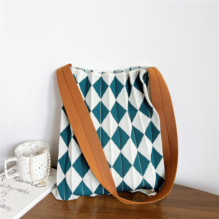 Viridian and white argyle knitted tote bag, stretchable and convenient for everyday storage.