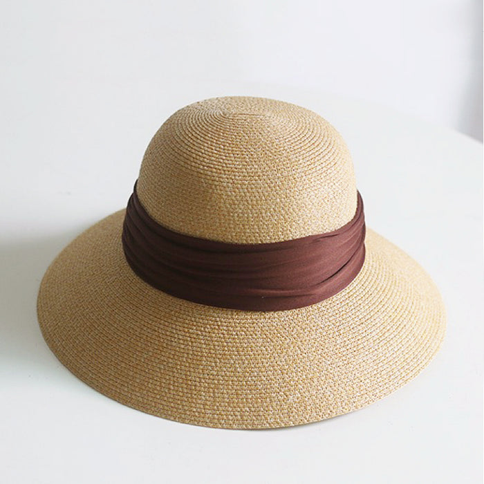 Front view of brown Ribbon Straw Hat. Rich chocolate tone with a refined weave and matching ribbon accent.