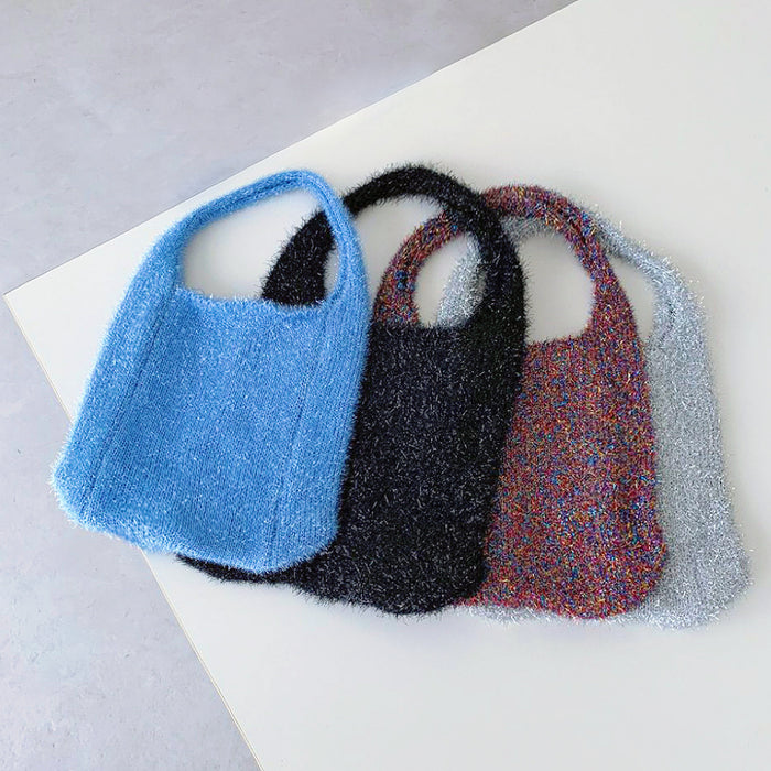 A row of blue, black, silver, and purple glitter bags showing all the sparkly color options.