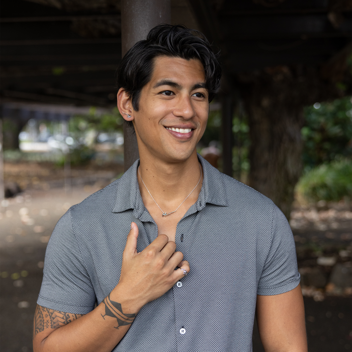 Man outdoors wearing a Hammerhead Shark Ring in Sterling Silver
