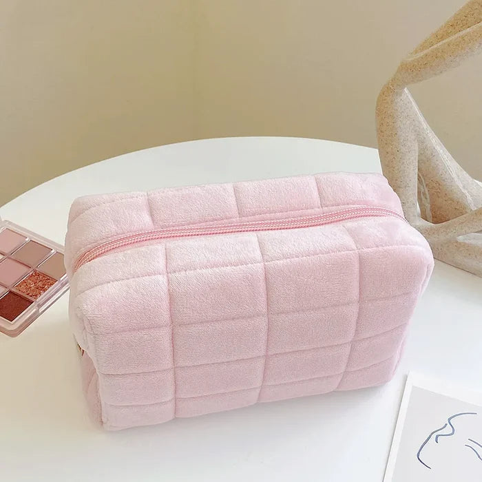 Angled view of Icecream Makeup Bag in pink, ideal for travel makeup and toiletries.