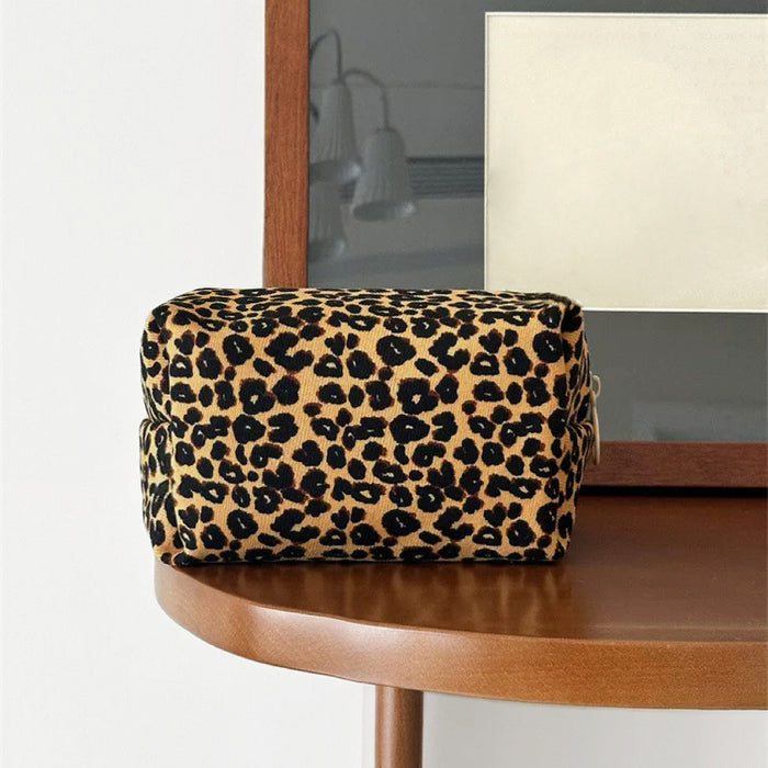 Folded view of Leopard Allure Makeup Bag in golden, great for on-the-go touch-ups.