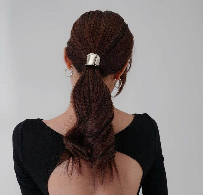 Model wearing a silver Metallic Wave Hair Cuff, ideal for quick updos and ponytails.