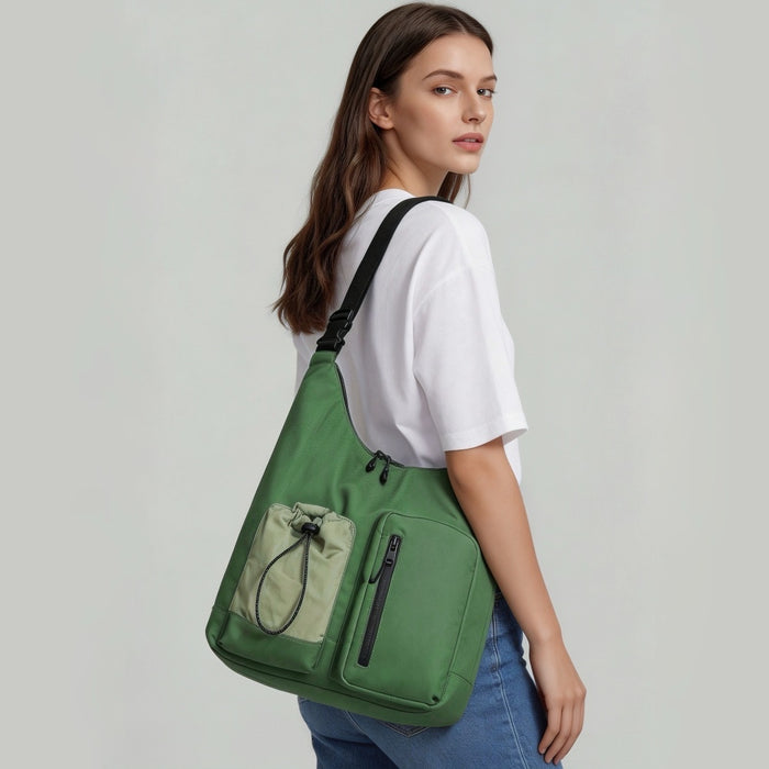Model wearing a green multi-pocket nylon bag on shoulder.
