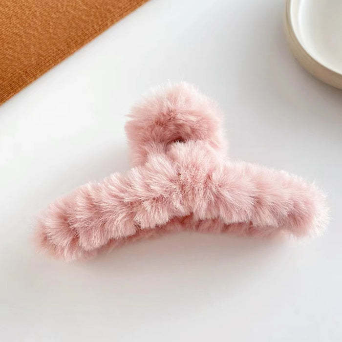 Angled view of Multicolor Plush Hair Claw in pink, great for everyday styling and gifting.