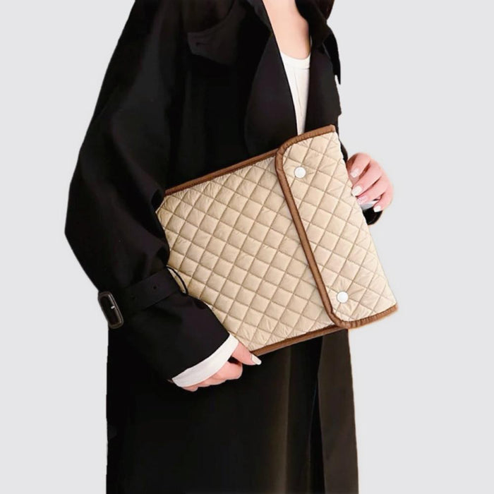 Model carrying a khaki laptop sleeves handheld, great for daily carry and travel.