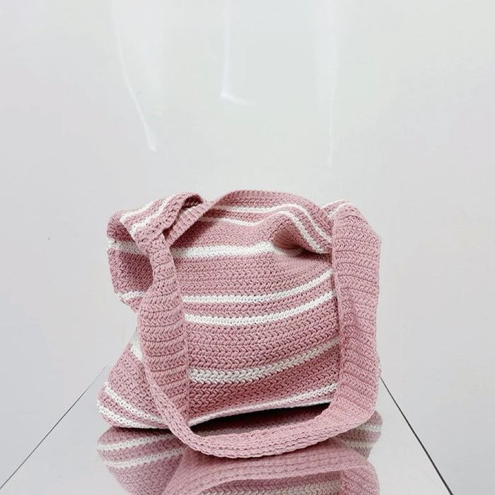 Folded view of pink and white Simple Striped Knitted Bag, great for everyday carry and travel.