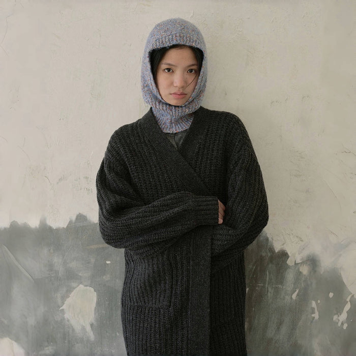 Model wearing Speckled Yarn Knit Balaclava Hat in pale blue. Serene color with intricate speckled patterns.