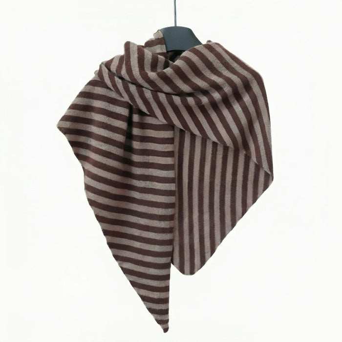 Angled view of Brown and light grey striped wool scarf hanging on a clean background
