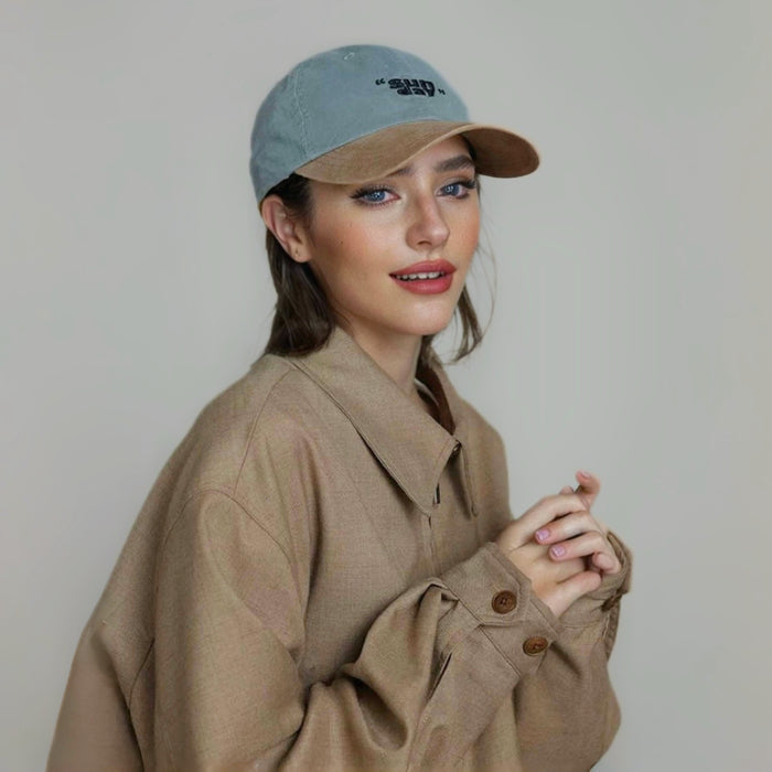 Model wearing blue Sun Day Cap. Boasts a durable curved brim and premium breathable fabric for sunny days.