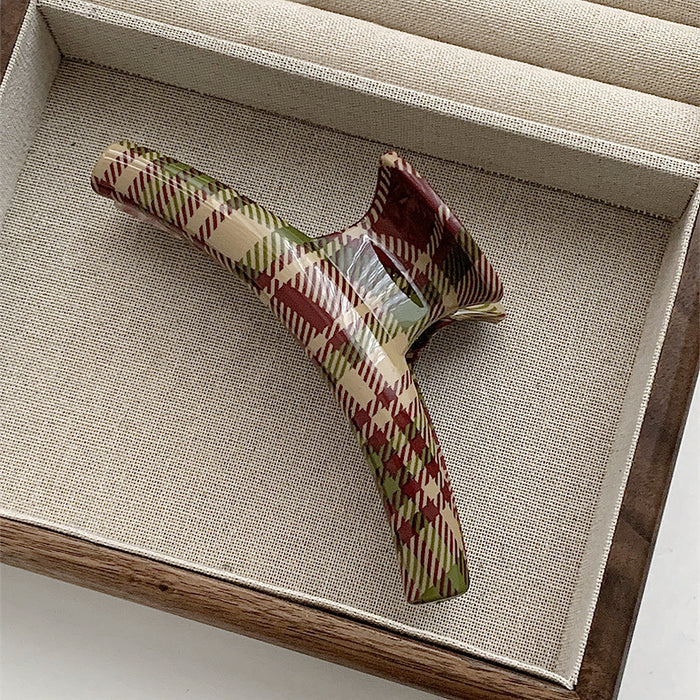 Angled view of arc Tartan Elegance Hair Claw, great for everyday styling and gifting.