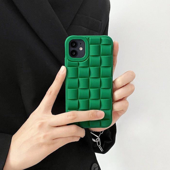 Green 3D plaid silicone iPhone case held by hands, showcasing its unique embossed textured relief design.