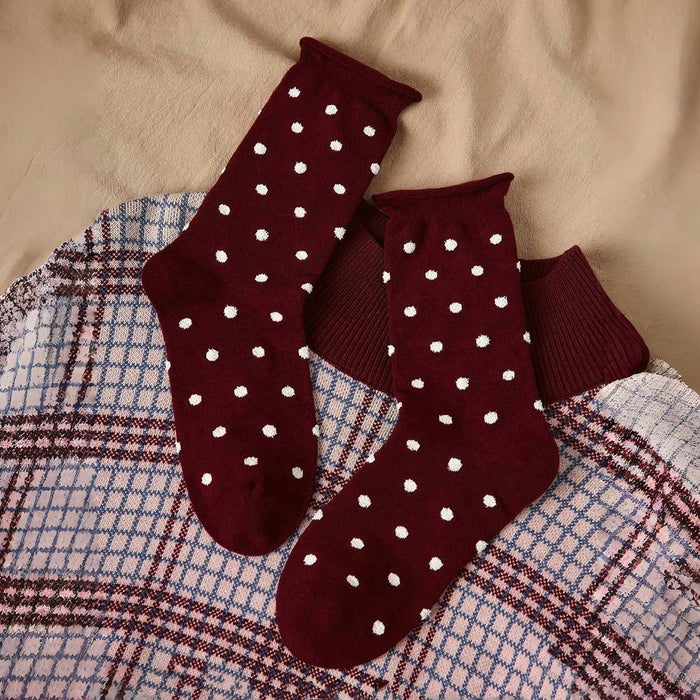Front view of Ancora red polka dot cotton-polyester socks with white dots.