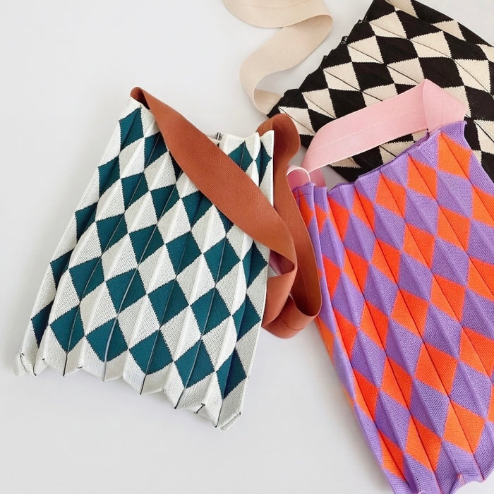 Comparison of three color variants of the stretchable argyle pleated bag.