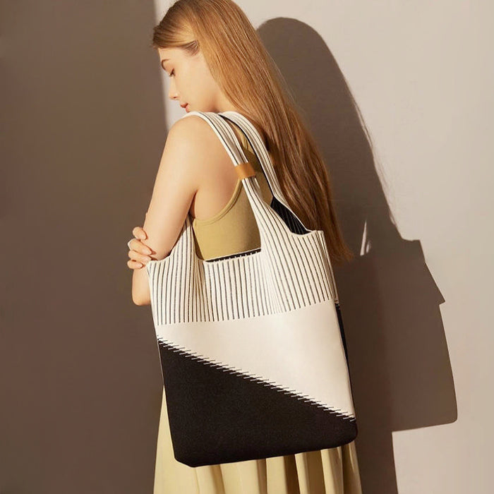 Artistic cream and black geometric pattern knitted tote bag made of soft polyester for gallery openings.