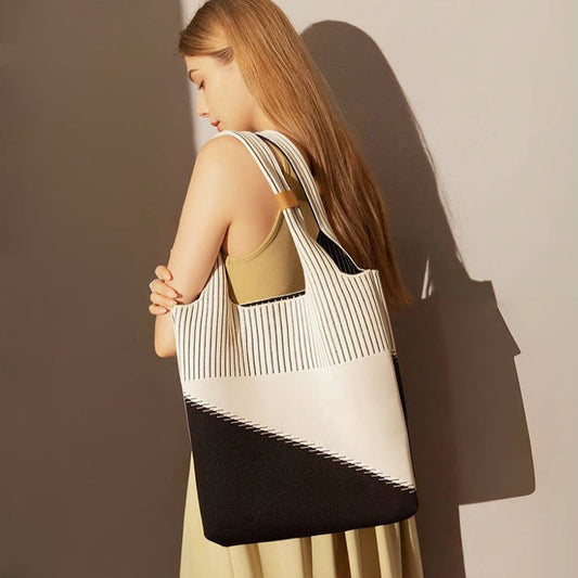 Artistic cream and black geometric pattern knitted tote bag made of soft polyester for gallery openings.