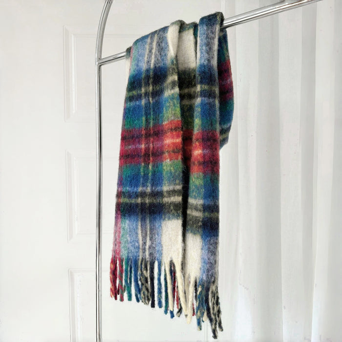 Flat lay of Autumn Ember Plaid Scarf in green and red, easy for travel packing and gifting.