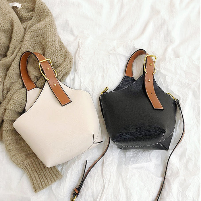 Front view of two Balloon Bucket Bags, one is black and the othe is white.