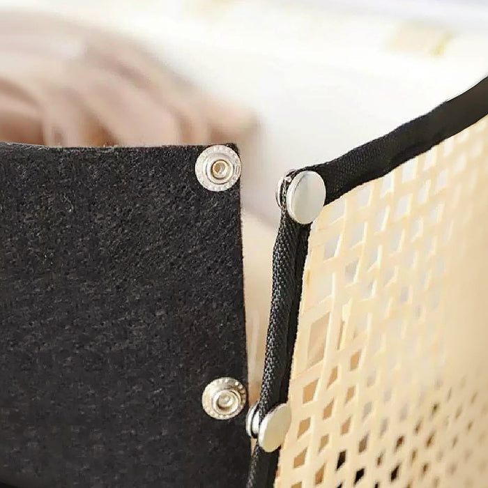 Detail view of the snap connection of bamboo storage basket.