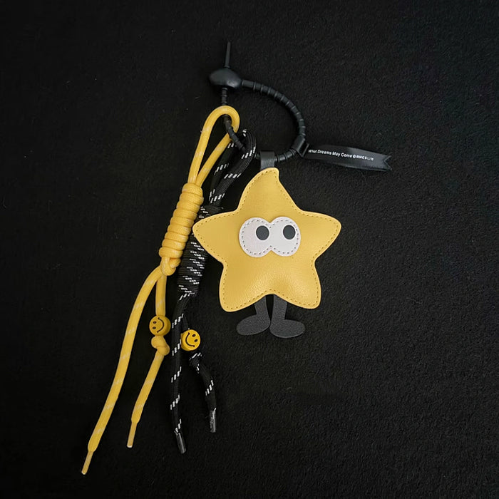 Close-up of Big-eyed Stars Bag Charm in yellow , ideal for travel and daily use.
