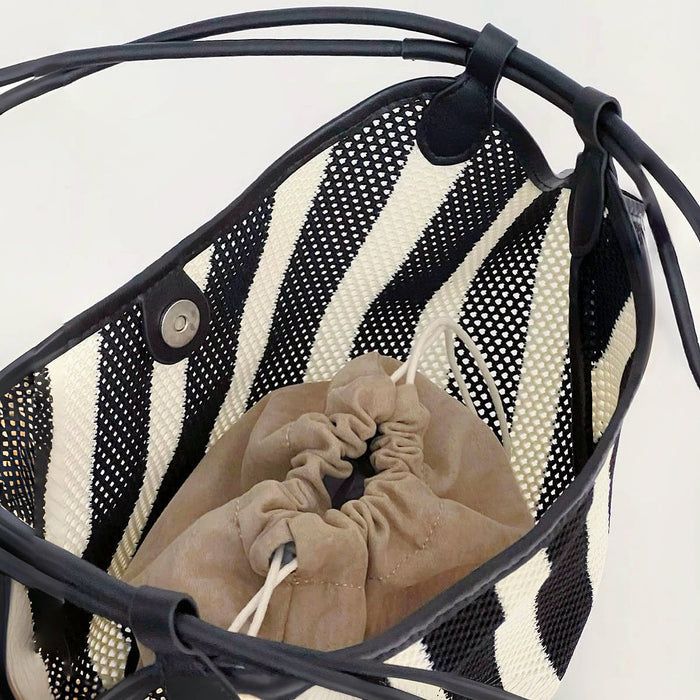 Top view of Black And White Striped Basket Bag, showing the interior.
