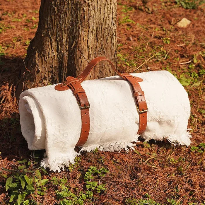 Close-up of Portable Packing Strap with blanket packed , ideal for travel and picnic.