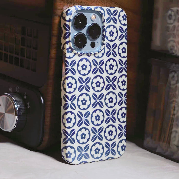 Front view of Blue White Porcelain Case. Vintage-inspired floral motif on a resilient clear silicone frame.