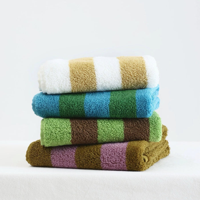 Stack of four folded towels with stripes in White-Mustard, blue/green, Rose Violet -Yellowish Brown, and Green-Brown.