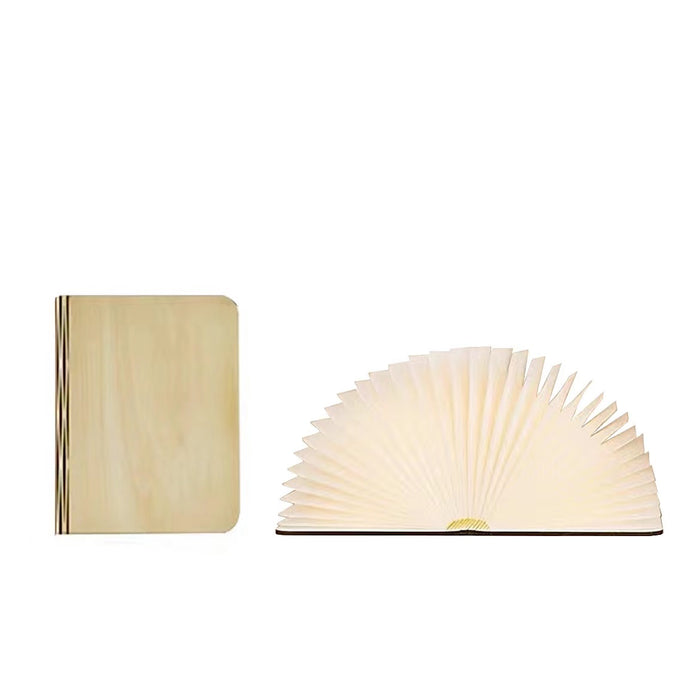Walnut wood book lamp, closed and open, showing its fan-like LED light and magnetic spine.