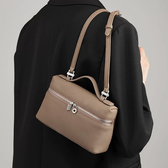Model carrying a khaki shoulder bag , ideal for city walks and gifting.
