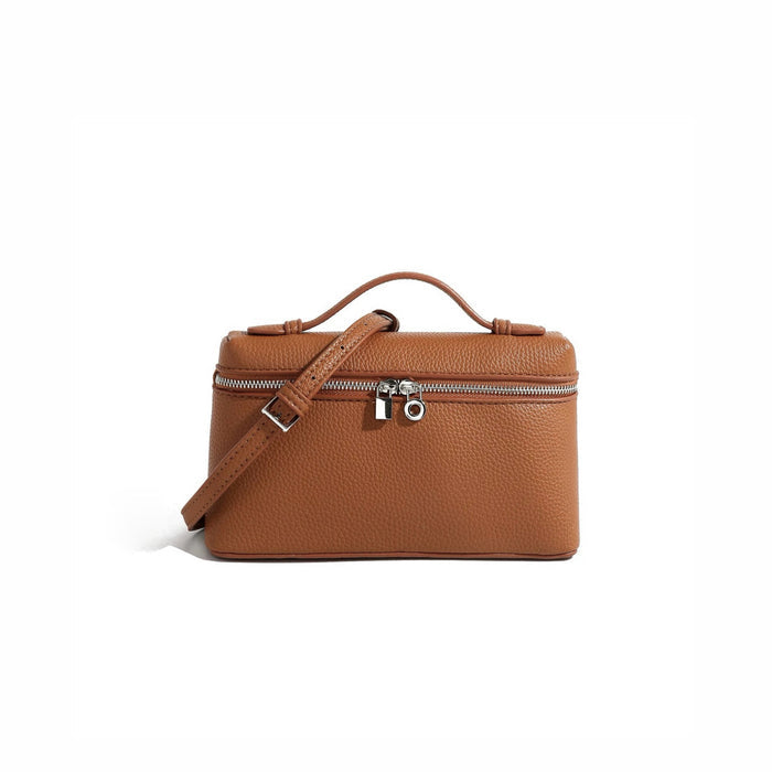 Angled view of Boxy Glamour Leather Bag in tan, great for everyday carry and travel.