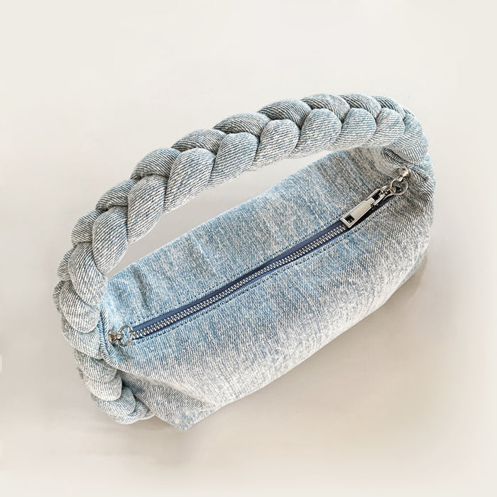 Flat lay of Braided Handle Denim Handbag in light blue, great for everyday carry and travel.