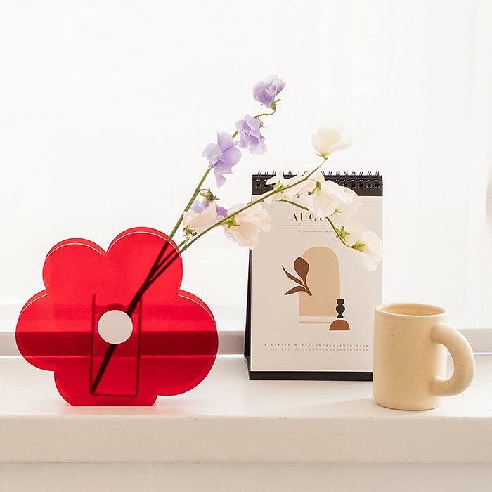 Front view of Bright red acrylic flower vase with a unique flower shape.