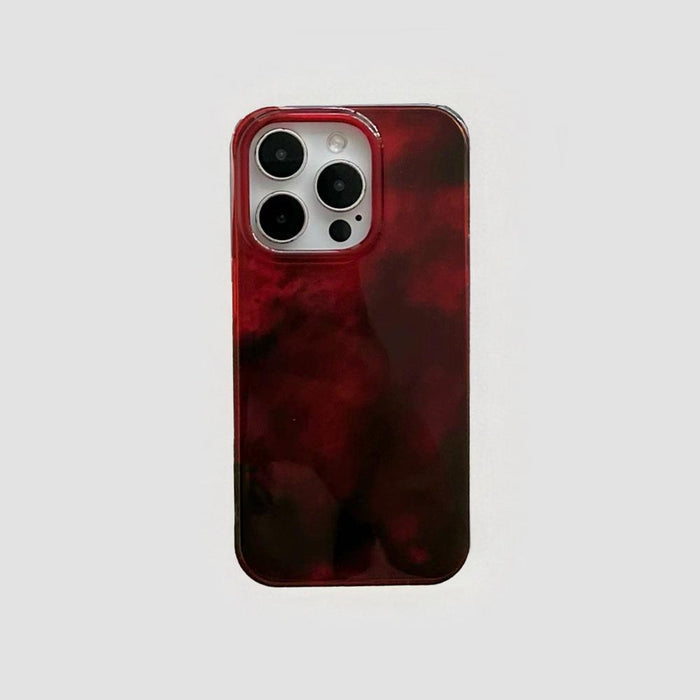 Burgundy acrylic phone case with a swirled flux design. Sophisticated fluid art style with precise camera cutouts.