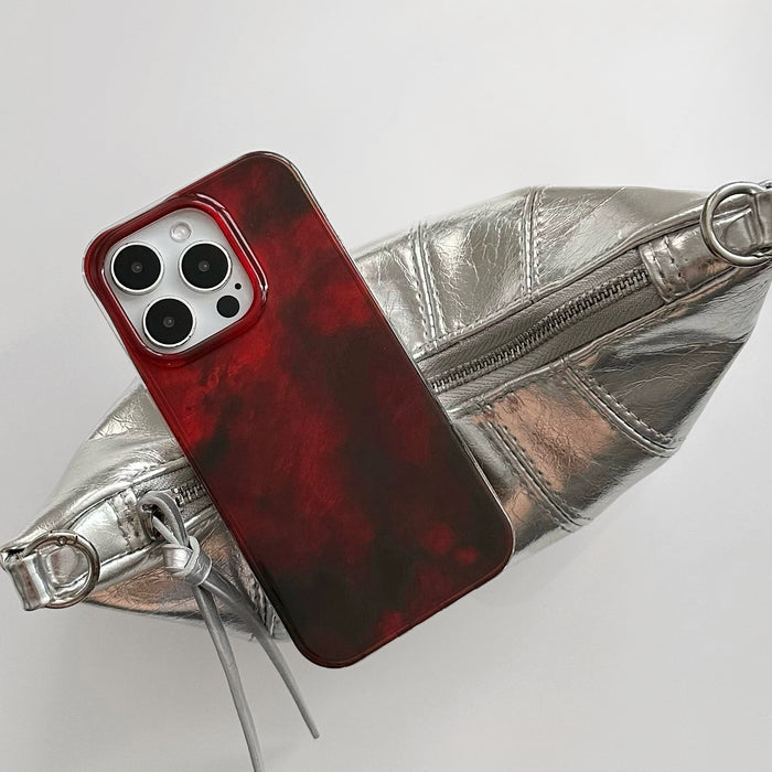 Aesthetic view of Burgundy Flux Case, capturing a sense of modern motion and deep luxurious red tones.