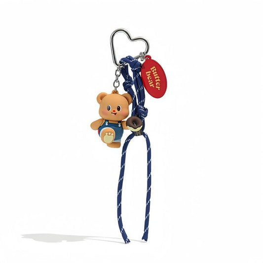 Front view of Cute Butter Bear bag charm with blue rope and heart-shaped alloy keyring.