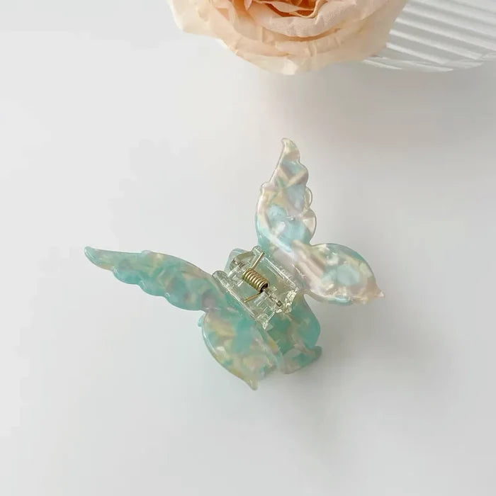 Close-up of butterfly hair claw in green, easy for workdays and special occasions.