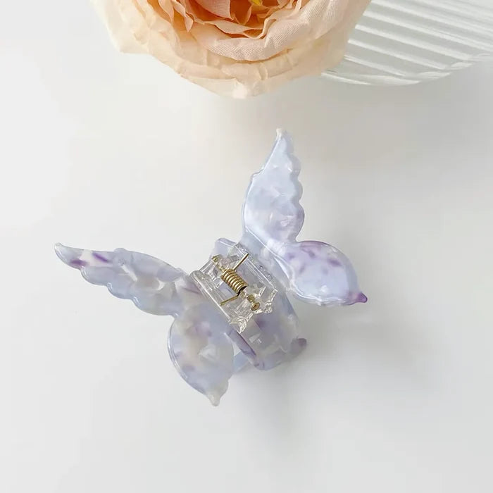 Folded view of butterfly hair claw in purple, ideal for quick updos and ponytails.