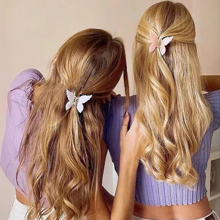 Two models wearing butterfly hair claw in white and pink , easy for workdays and special occasions.