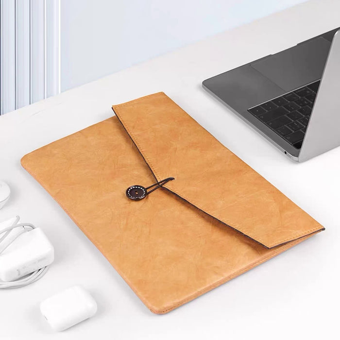 Close-up of caramel Tyvek envelope laptop sleeve , ideal for errands and gifting.
