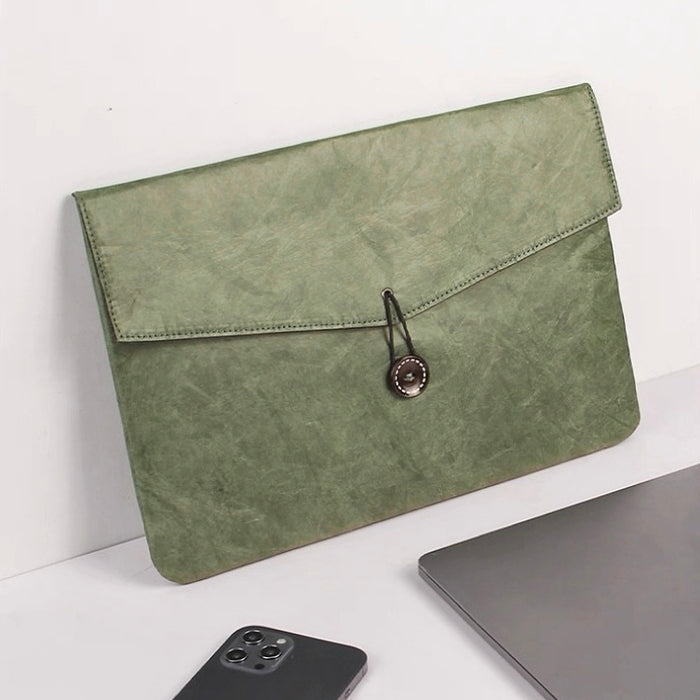 Flat lay of Buttoned Envelope Laptop Sleeve bag in olive green, great for everyday carry and travel.
