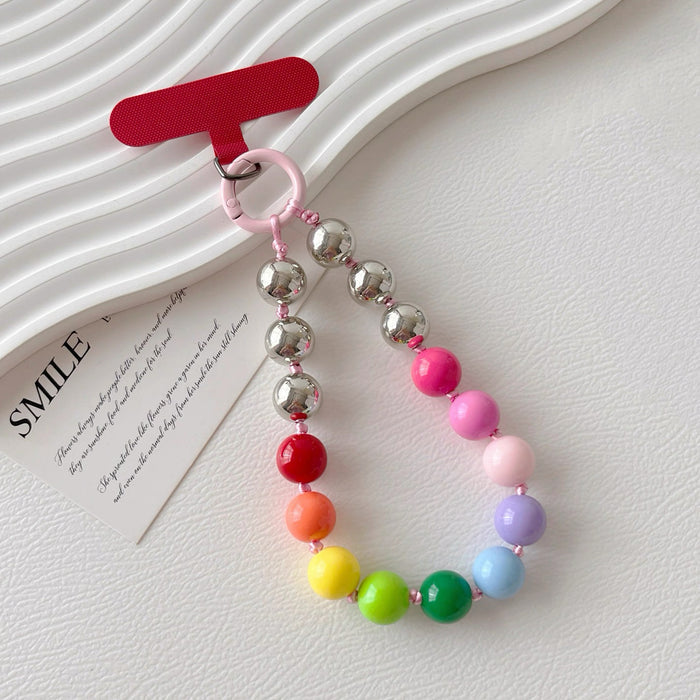 Angled view of Candy Bead Phone Charm in rainbow colors, easy to attach to bags and phones.